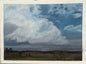 Gathering Storm by Melanie Fattig, dramatic blue-gray clouds above an open prairie landscape
